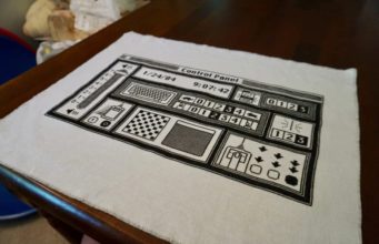 Žena vytváří vyšívané obrazy znázorňující rozhraní Applu